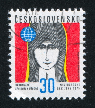 CZECHOSLOVAKIA - CIRCA 1975: stamp printed by Czechoslovakia, shows Young Woman and Globe, circa 1975のeditorial素材