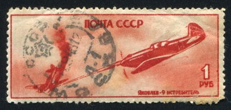 RUSSIA - CIRCA 1945: stamp printed by Russia, shows Iakovlev fighter in action, circa 1945のeditorial素材