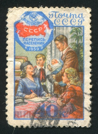 RUSSIA - CIRCA 1958: stamp printed by Russia, shows Census emblem and family, circa 1958のeditorial素材