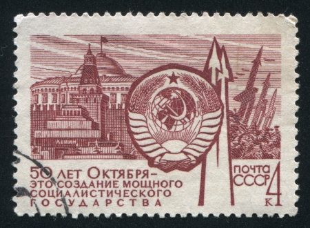 RUSSIA - CIRCA 1967: stamp printed by Russia, shows Coat of Arms, Leninâs Tomb and Rockets, circa 1967のeditorial素材