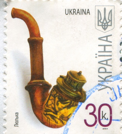 UKRAINE - CIRCA 2010: stamp printed by Ukraine, shows Tobacco pipe, circa 2010のeditorial素材