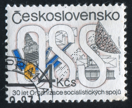 CZECHOSLOVAKIA - CIRCA 1987: stamp printed by Czechoslovakia, shows Socialist Communications Organization, Emblem, satellite, dish receiver, circa 1987のeditorial素材
