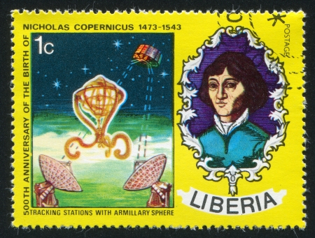 LIBERIA - CIRCA 1973: stamp printed by Liberia, shows Nicolaus Copernicus, armillary sphere and satellite communication, circa 1973のeditorial素材