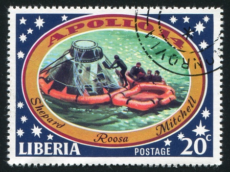 LIBERIA - CIRCA 1971: stamp printed by Liberia, shows Astronaut leaving capsule, circa 1971のeditorial素材