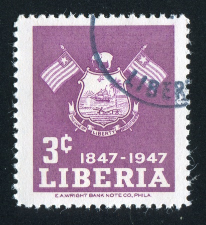 LIBERIA - CIRCA 1947: stamp printed by Liberia, shows Liberian arms, circa 1947のeditorial素材
