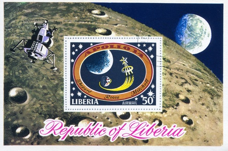 LIBERIA - CIRCA 1971: stamp printed by Liberia, shows Moon, Earth and star, circa 1971のeditorial素材