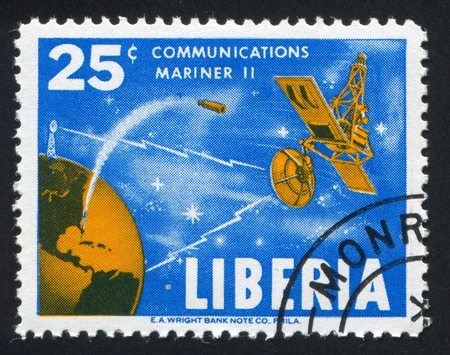 LIBERIA - CIRCA 1964: stamp printed by Liberia, shows Satellite Mariner, circa 1964のeditorial素材
