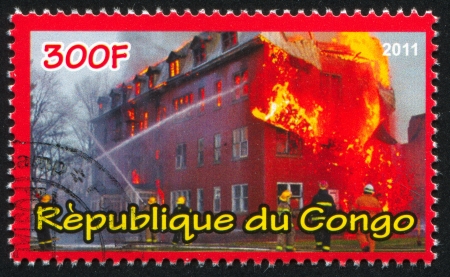 CONGO - CIRCA 2012: stamp printed by Congo, shows Burning building, circa 2012のeditorial素材