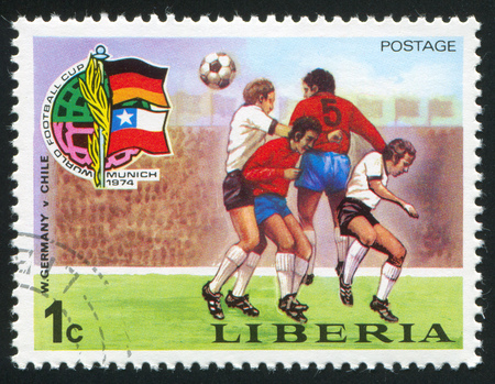 LIBERIA - CIRCA 1974: stamp printed by Liberia, shows football, circa 1974のeditorial素材