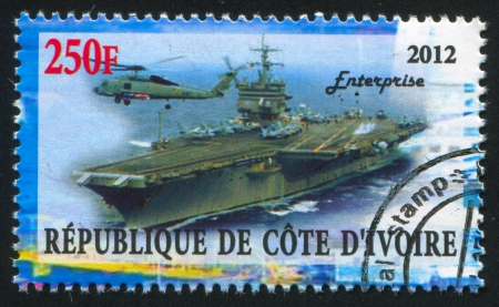 IVORY COAST CIRCA 2012: stamp printed by Ivory Coast, shows aircraft carrier, circa 2012のeditorial素材