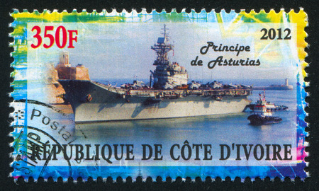 IVORY COAST CIRCA 2012: stamp printed by Ivory Coast, shows aircraft carrier, circa 2012のeditorial素材