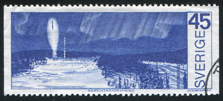 SWEDEN - CIRCA 1970: stamp printed by Sweden, shows Rocket probe under northern lights, circa 1970のeditorial素材