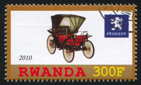 RWANDA - CIRCA 2010: stamp printed by Rwanda, shows retro car, Peugeot, circa 2010のeditorial素材