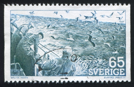 SWEDEN - CIRCA 1974: stamp printed by Sweden, shows Seine fishing, circa 1974のeditorial素材