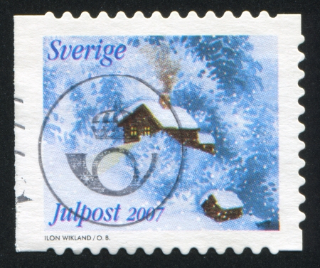 SWEDEN - CIRCA 2007: stamp printed by Sweden, shows Houses in winter, circa 2007のeditorial素材