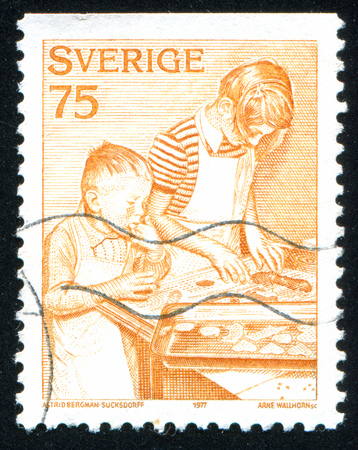 SWEDEN - CIRCA 1975: stamp printed by Sweden, shows Baking ginger snaps, circa 1975のeditorial素材