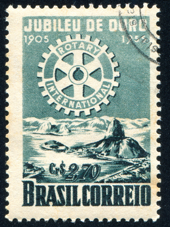 BRAZIL - CIRCA 1955: stamp printed by Brazil, shows  Rotary Emblemo and Bay of Rio de Janeiro, circa 1955のeditorial素材