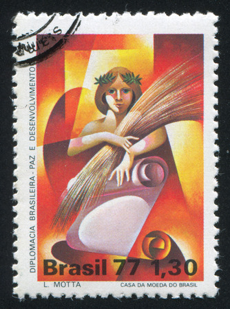 BRAZIL - CIRCA 1977: stamp printed by Brazil, shows  Woman Holding Sheaf, circa 1977のeditorial素材