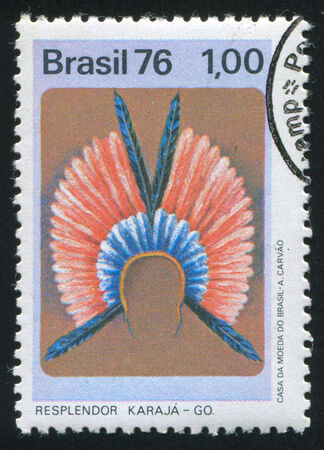 BRAZIL - CIRCA 1976: stamp printed by Brazil, shows  Karaja feather headdress, circa 1976のeditorial素材