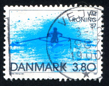 DENMARK - CIRCA 1987: stamp printed by Denmark, shows Single sculler, circa 1987のeditorial素材