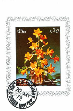 SHARJAH AND DEPENDENCIES - CIRCA 1972: stamp printed by Sharjah and Dependencies, shows flower and vase, circa 1972のeditorial素材