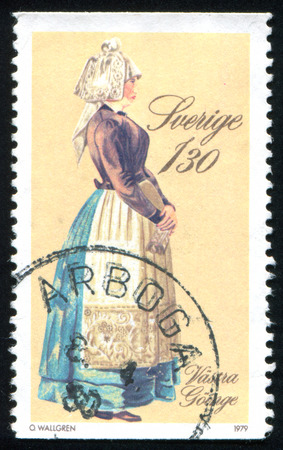 SWEDEN - CIRCA 1979: stamp printed by Sweden, shows Costumes and Jewelry, circa 1979のeditorial素材