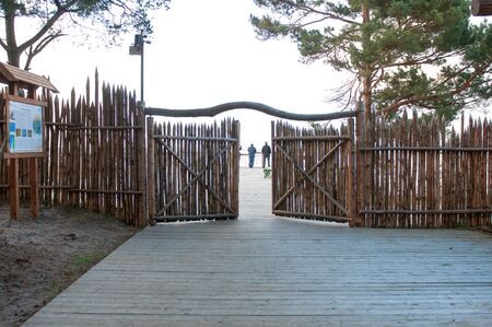 Wooden fence in the national park Curonian Spit. Spring season.の写真素材