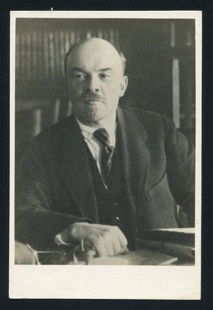 RUSSIA - CIRCA 1963: post card printed by Russia USSR, shows soviet revolutionary and politician Vladimir Lenin, Vladimir Lenin in his study-room in the Kremlin. Moscow, October 1922, circa 1963のeditorial素材
