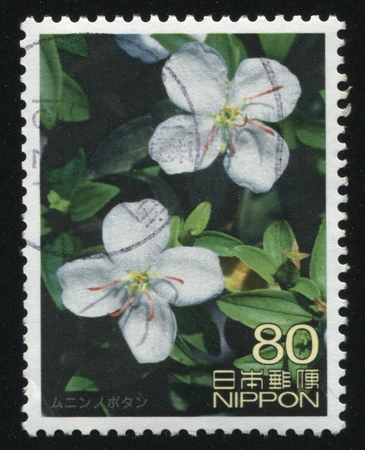 RUSSIA KALININGRAD, 18 MARCH 2016: stamp printed by Japan shows flower, circa 2012のeditorial素材