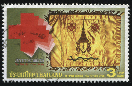 RUSSIA KALININGRAD, 31 MAY 2016: stamp printed by Thailand, shows silk handkerchief with a portrait, red cross, cirka 2005のeditorial素材