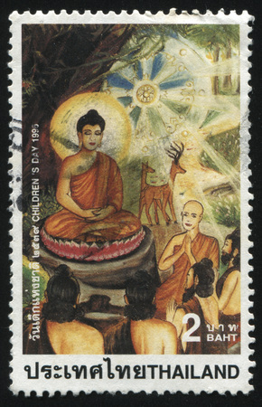 RUSSIA KALININGRAD, 31 MAY 2016: stamp printed by Thailand, shows children's drawing of monks and holy, cirka 1995のeditorial素材
