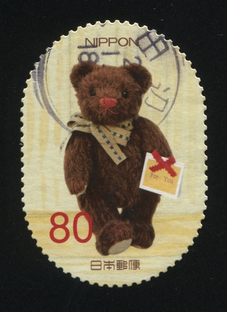 RUSSIA KALININGRAD, 18 MARCH 2016: stamp printed by Japan shows Teddy bear, circa 2012のeditorial素材