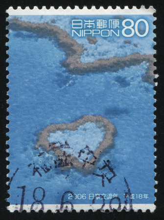 RUSSIA KALININGRAD, 18 MARCH 2016: stamp printed by Japan, shows a heart-shaped  Reef in the ocean, circa 2006のeditorial素材