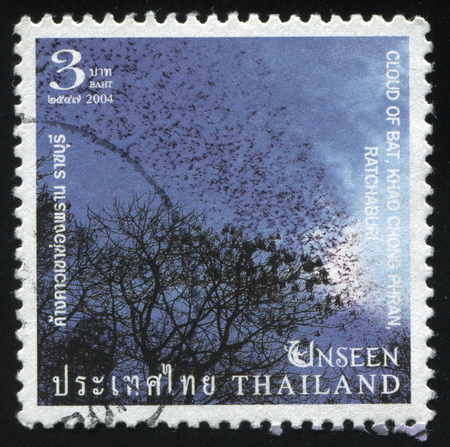 RUSSIA KALININGRAD, 3 JUNE 2016: stamp printed by Thailand, shows trees in the night, cloud of Bat, circa 2004のeditorial素材