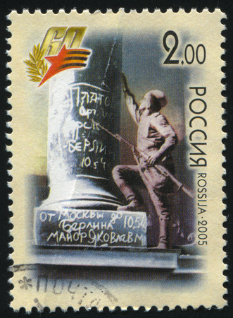 RUSSIA KALININGRAD, 27 OCTOBER 2016: stamp printed by Russia, shows a soldier who is writing words on the monument in Berlin, circa 2005のeditorial素材