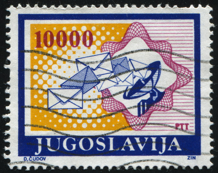 RUSSIA KALININGRAD, 12 NOVEMBER 2016: stamp printed by Yugoslavia, shows an antenna with flying letters, circa 1988のeditorial素材