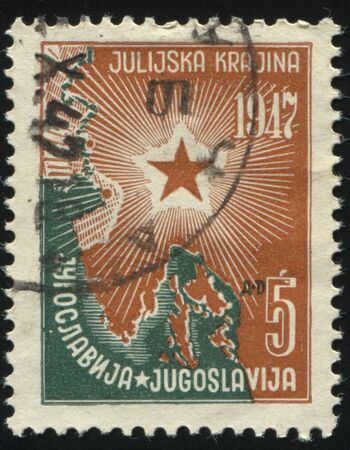 RUSSIA KALININGRAD, 12 NOVEMBER 2016: stamp printed by Yugoslavia, shows map and star, circa 1947のeditorial素材