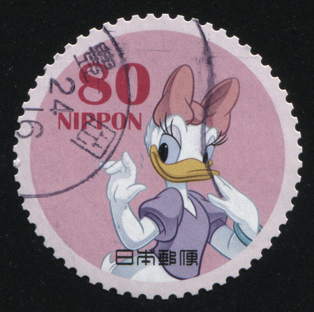 RUSSIA KALININGRAD, 22 APRIL 2016: stamp printed by Japan, shows Daisy Duck waving with her hand, circa 2011のeditorial素材