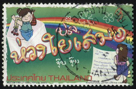 RUSSIA KALININGRAD, 2 JUNE 2016: stamp printed by Thailand, shows girls writing letter, circa 2013のeditorial素材