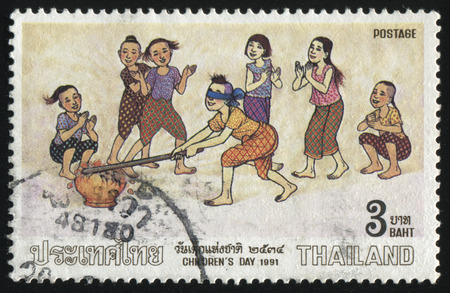 RUSSIA KALININGRAD, 2 JUNE 2016: stamp printed by Thailand, shows girls playing, circa 1991のeditorial素材