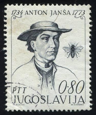 RUSSIA KALININGRAD, 12 NOVEMBER 2016: stamp printed by Yugoslavia, shows the portrait of Anton Jansa, teacher and a bee, circa 1973のeditorial素材