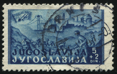RUSSIA KALININGRAD, 12 NOVEMBER 2016: stamp printed by Yugoslavia, shows young railway laborers, circa 1947のeditorial素材