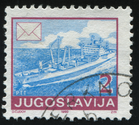 RUSSIA KALININGRAD, 12 NOVEMBER 2016: stamp printed by Yugoslavia, shows Freighter in hugh sea, circa 1986のeditorial素材