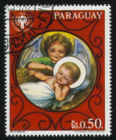 RUSSIA KALININGRAD, 22 APRIL 2017: stamp printed by Paraguay, shows Jesus and Angel, circa 1980のeditorial素材