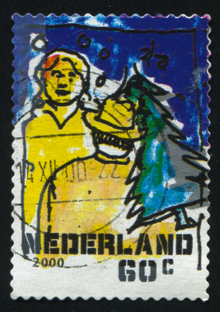RUSSIA KALININGRAD, 4 JULY 2017: stamp printed by Netherlands shows merry christmas holiday, circa 2000のeditorial素材