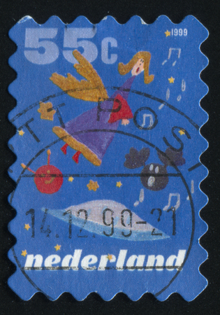 RUSSIA KALININGRAD, 4 JULY 2017: stamp printed by Netherlands shows merry christmas holiday, circa 1999のeditorial素材