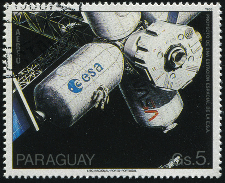 RUSSIA KALININGRAD, 22 APRIL 2017: stamp printed by Paraguay, shows NASA - ESA space station, circa 1988のeditorial素材