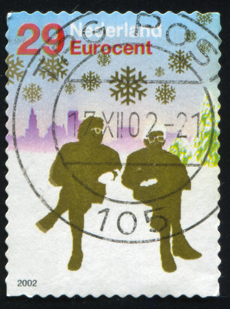 RUSSIA KALININGRAD, 4 JULY 2017: stamp printed by Netherlands shows merry christmas holiday, circa 2002のeditorial素材