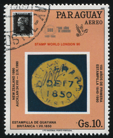 RUSSIA KALININGRAD, 22 APRIL 2017: stamp printed by Paraguay, shows Penny Black 150th anniversary and a seal from British Guiana, circa 1989のeditorial素材