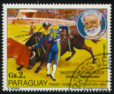 RUSSIA KALININGRAD, 19 APRIL 2017: stamp printed by Paraguay, shows the Nobel laureate for literature Ernest Hemingway, Death in the Afternoon, circa 1977のeditorial素材
